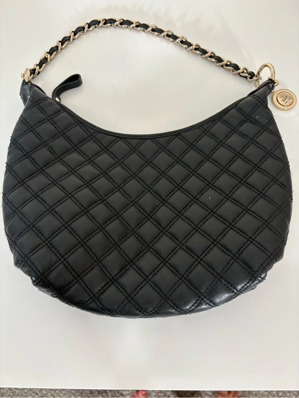 The Sak Black Quilted Leather Hobo with Gold Chain Detail